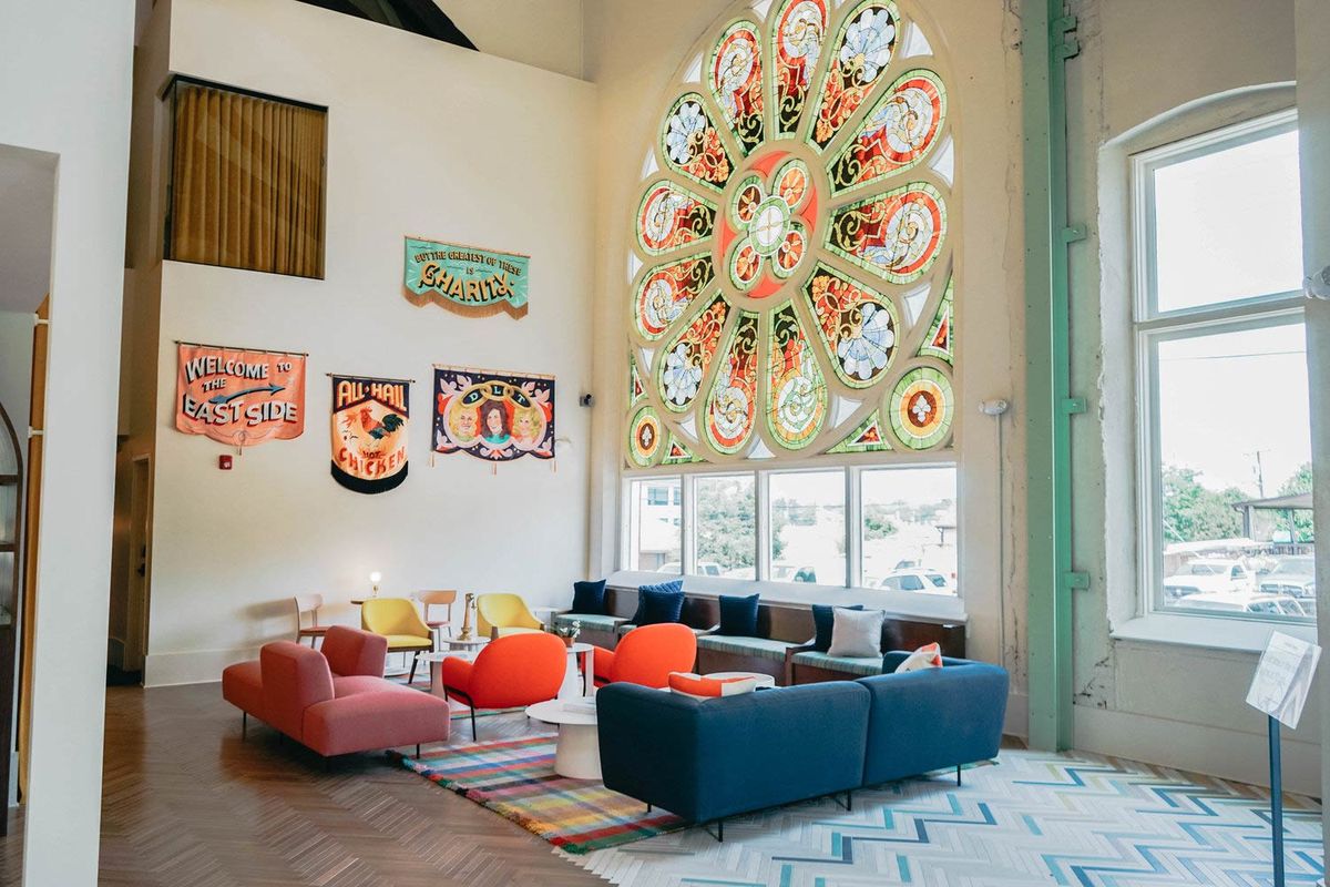 The Russell — the lounge inside the converted church, with a stained-glass rose window.